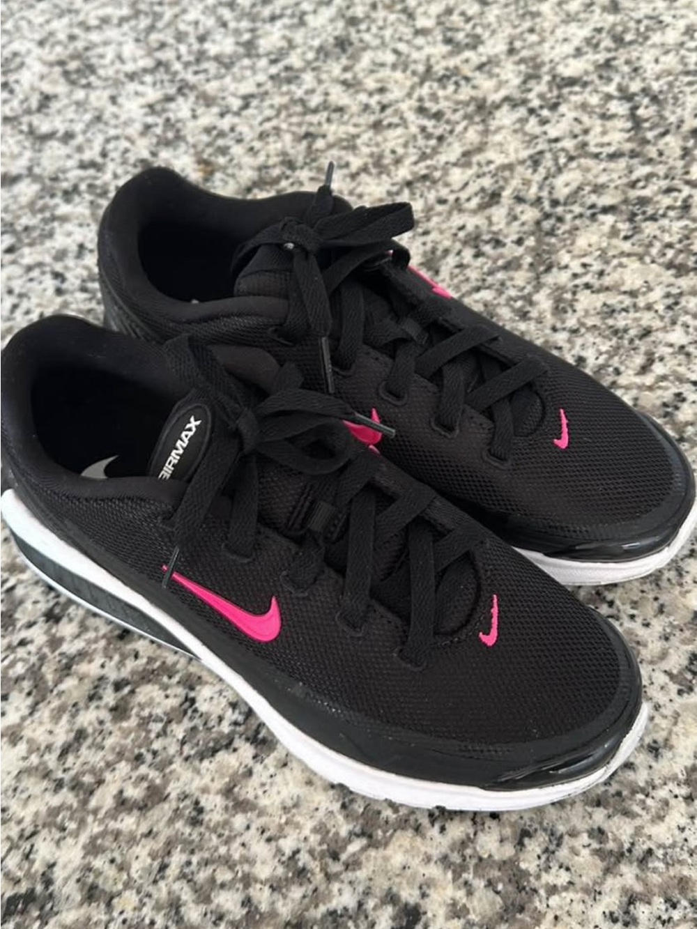 Nike Women's Black Athletic Sneakers with Pink Swoosh Accents